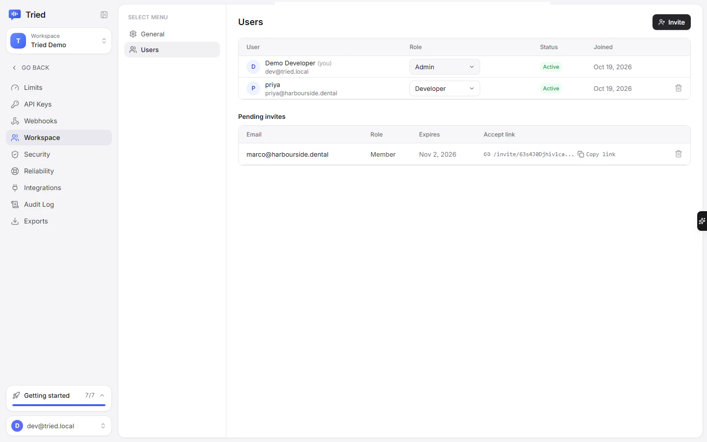 The Users table with role selectors, and pending invites below